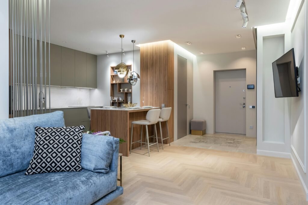 Bright and contemporary apartment interior featuring an open plan kitchen and living area.